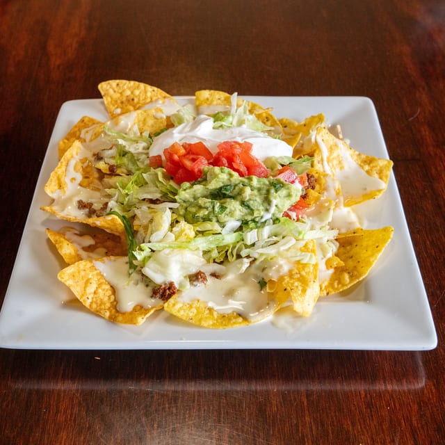 Nachos Supreme (Steak or Grilled Chicken).
